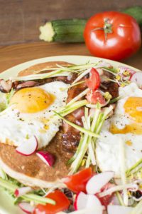Buckwheat pancakes with fried eggs & bacon