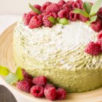 Matcha cake with coconut cream and raspberries